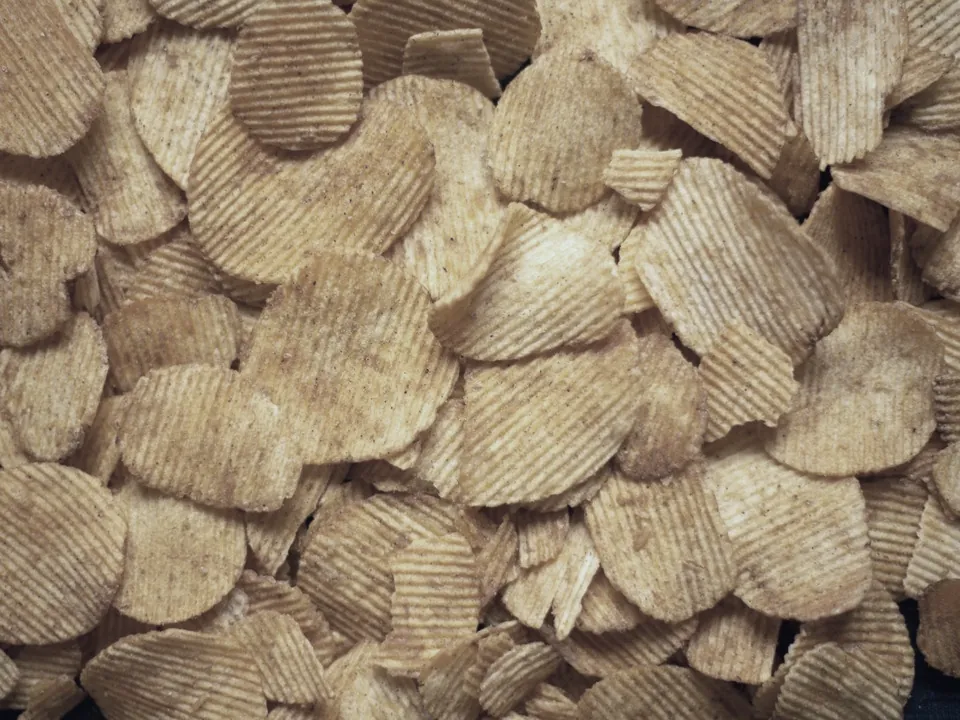 A heap of plain potato chips, the same salty snack as always.